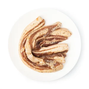 Plate of marinated pork belly curled up
