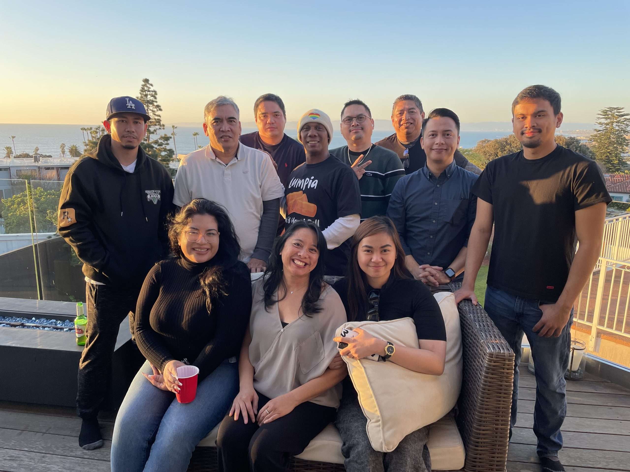Group of Filipino men and women in an outdoor setting patio